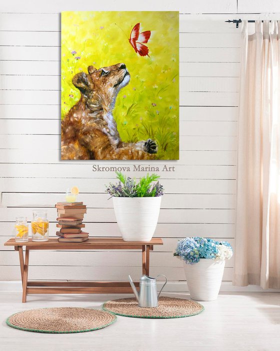 SMALL CHARM -Little lion cub. Adorable lion cub and butterfly. Simba plays. Cute predator. The lion king. Fairy tale. Wild nature. Flower meadow.