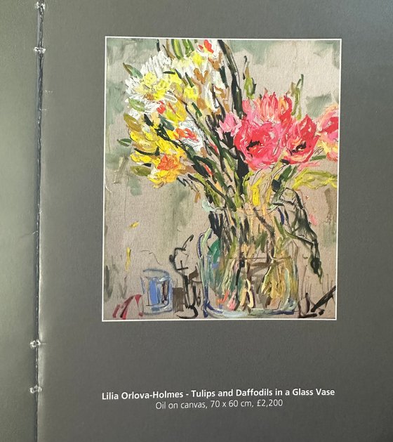 Tulips and daffodils in a glass vase