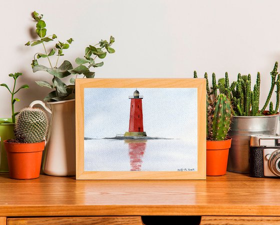 Red lighthouse in the sea.