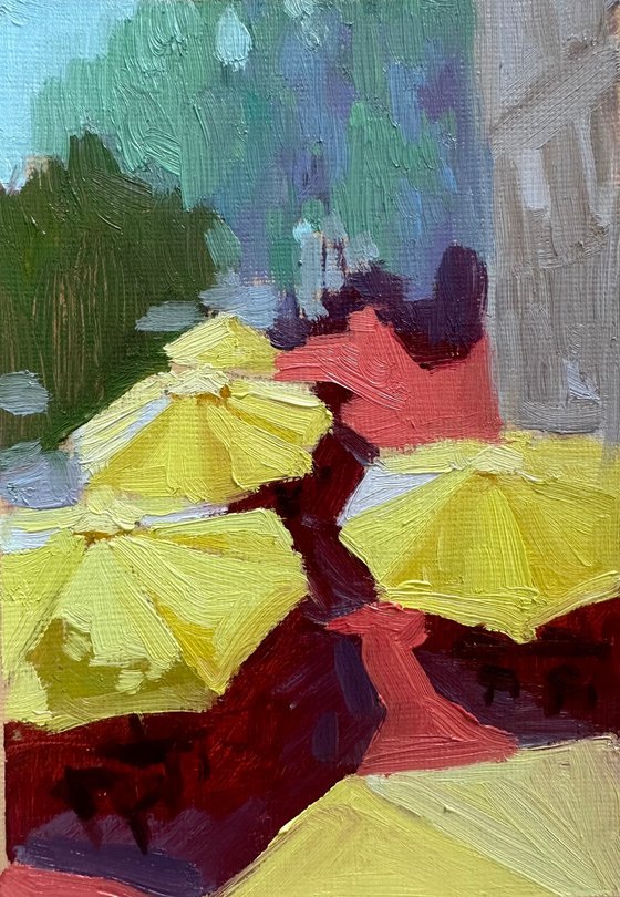 Cafe with yellow umbrellas