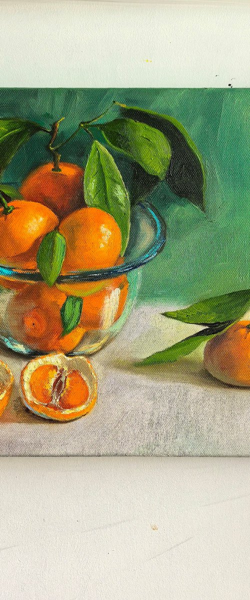 Tangerines in glass bowl by Leyla Demir