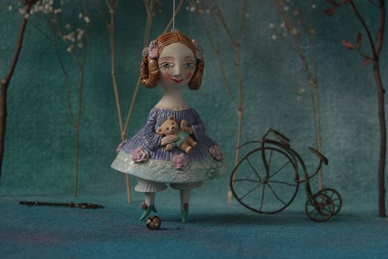 Little Girl in an blue dress with a teddy. Hanging sculpture, bell doll by Elya Yalonetski