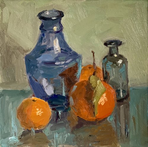 Oranges and blue glass by Nithya Swaminathan