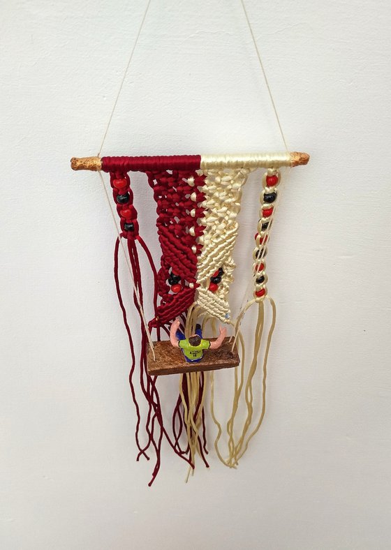 Boy and macrame wall hanging