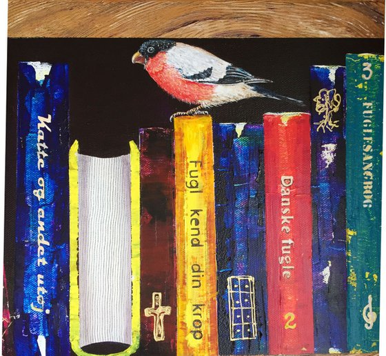 Bookshelf with a blackbird