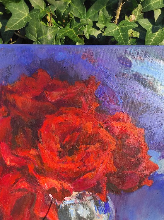 Red roses in a metal vase