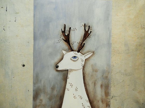 The white deer with leaves