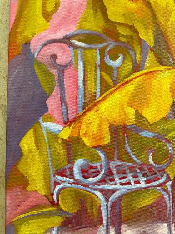 Yellow banana tree and garden chair