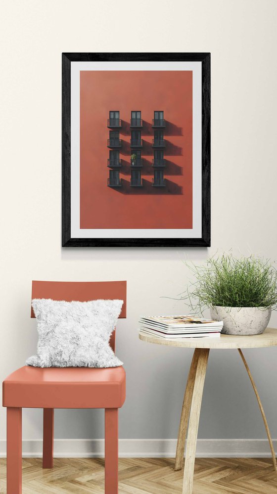 Red wall with a single tree