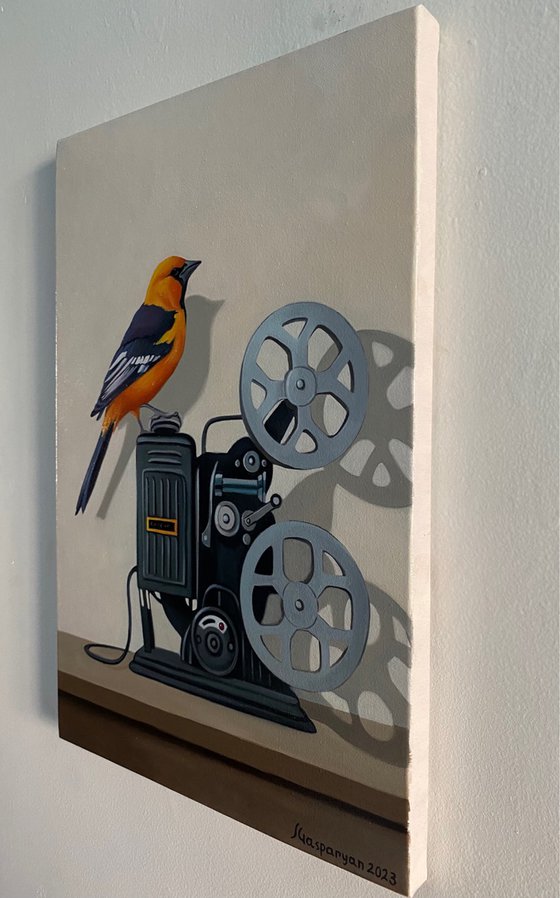 Still life with bird and old camera