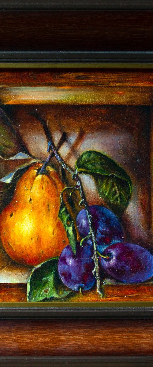 A ripe pear with a plum by Inga Loginova