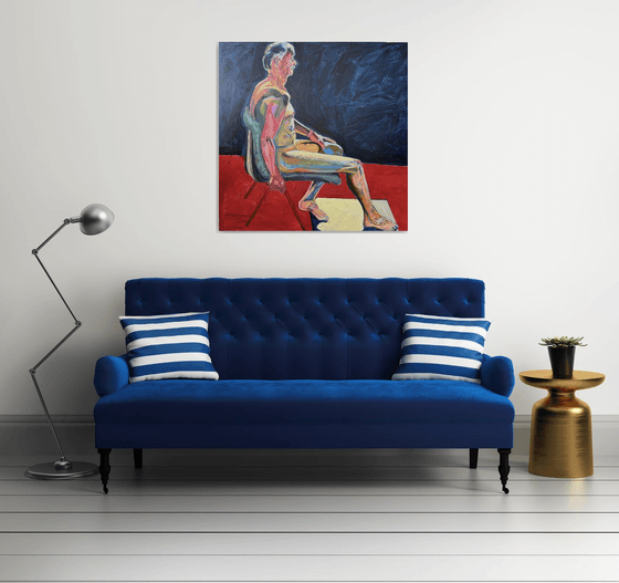 Seated Chap in dark blue room