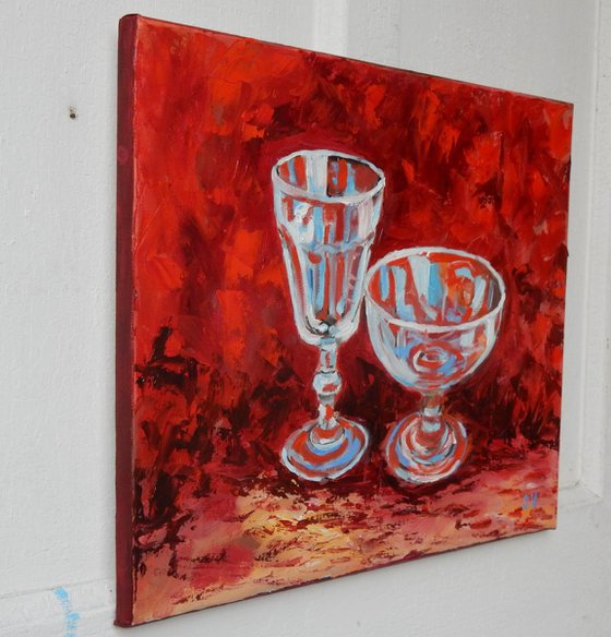 Wine glass on red.