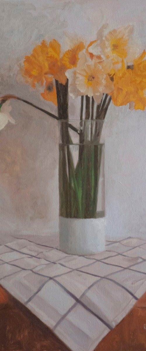 Yellow daffodils in a glass vase by Radosveta Zhelyazkova