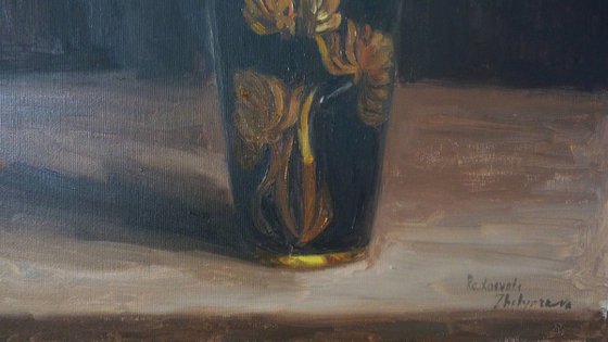 Five daffodils in a dark vase