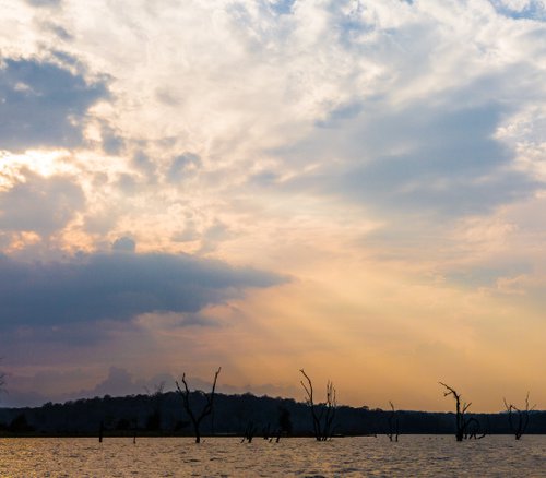 Sunset over lake by V Sebastian