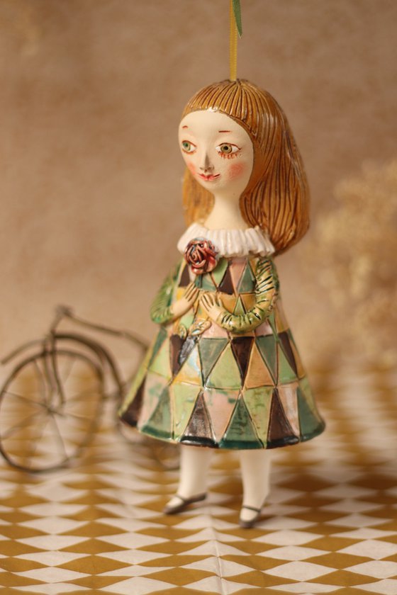 Innocent little girl with a flower. Hanging sculpture, bell doll by Elya Yalonetski