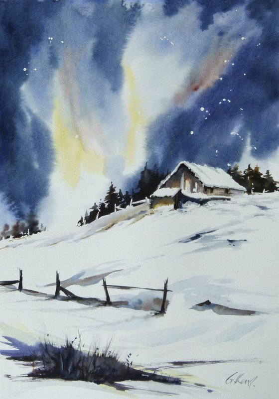 Barn on snowy hill.