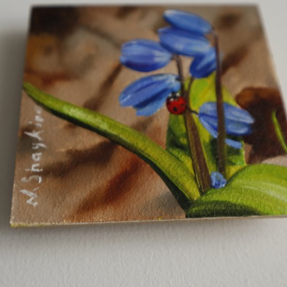 Blue Spring Flowers with Ladybug