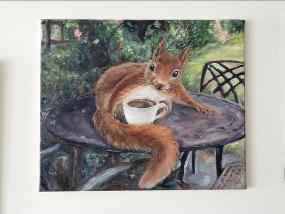 Red Squirrel With A Cup of Coffee