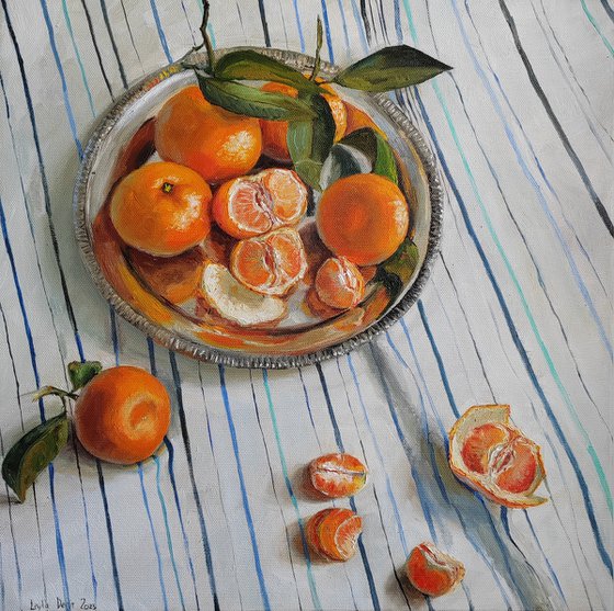 Clementines on stripen tablecloth