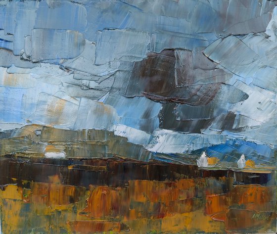 A landscape with clouds and cottages