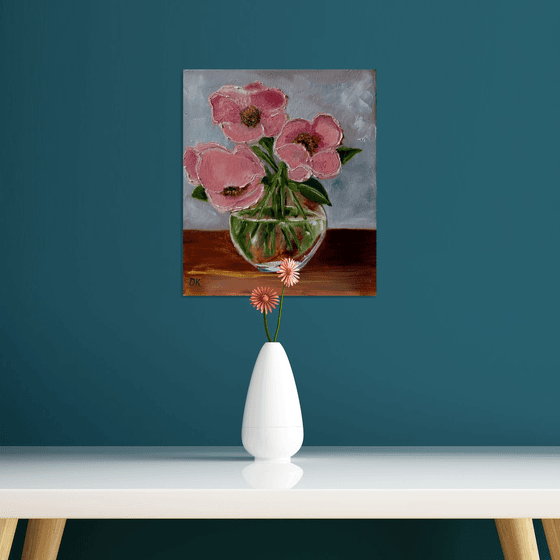 Bouquet of wild coral roses in a vase.