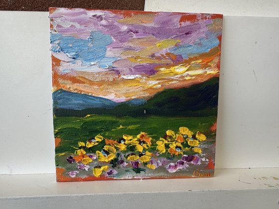 Orange sunset with flowers