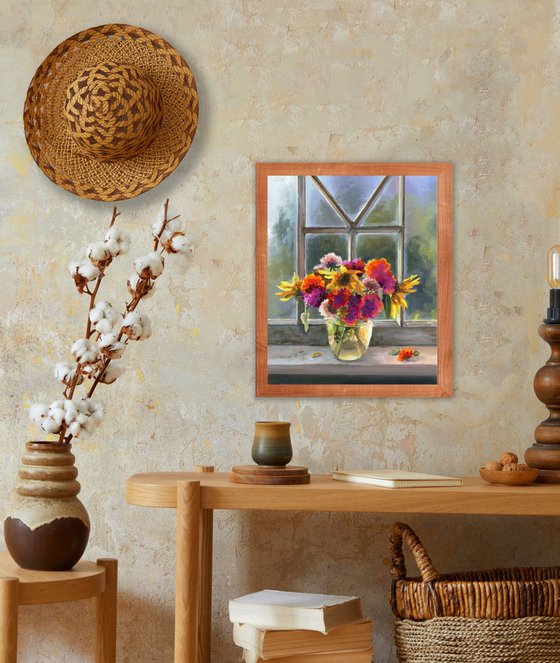 Vase of marigolds on a window