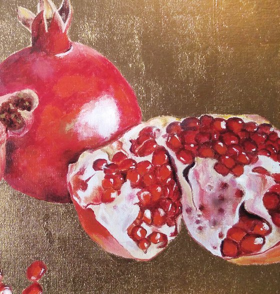 Pomegranate fruit on gold