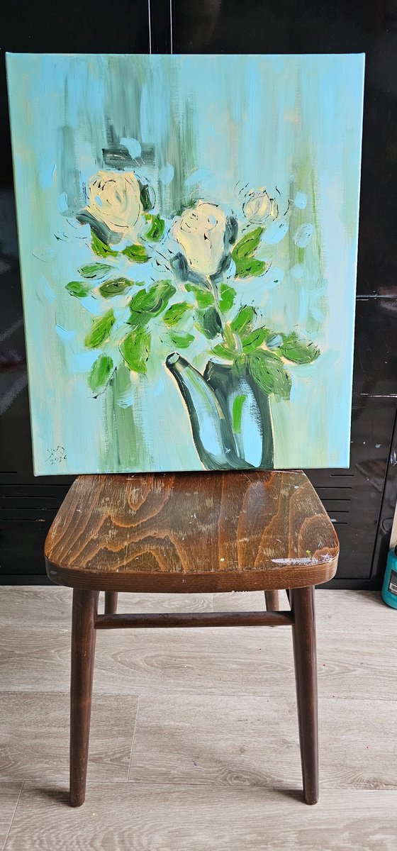 Yellow roses in a pot on blue