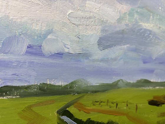 Clouds over the field and ditch