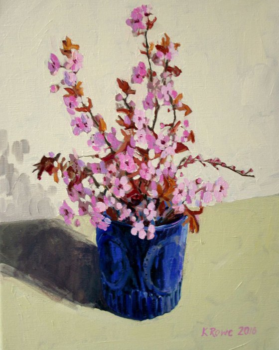 Cherry blossom in blue glass