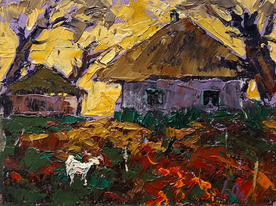 Yellow sunset behind houses