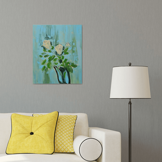 Yellow roses in a pot on blue