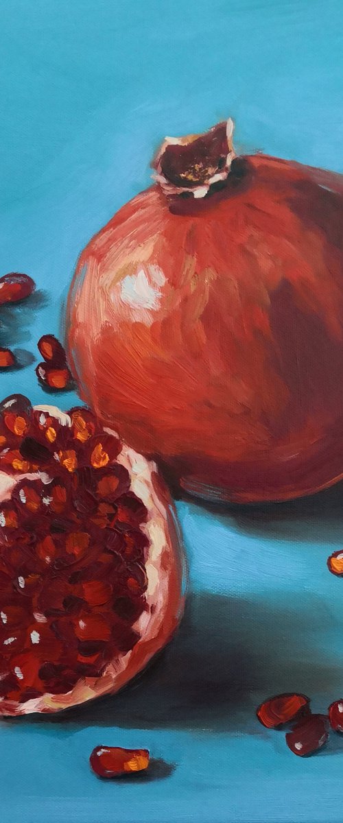 Ripe red pomegranates on turquoise - blue background still life 2 by Jane Lantsman