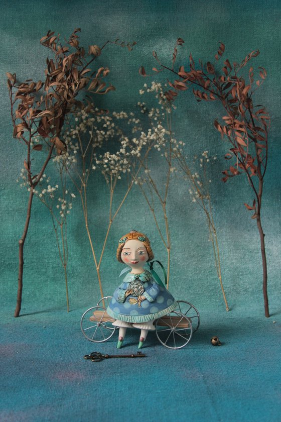 Little Girl in tender blue dress. Hanging sculpture, bell doll by Elya Yalonetski