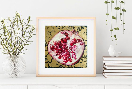 Pomegranate fruit in gold
