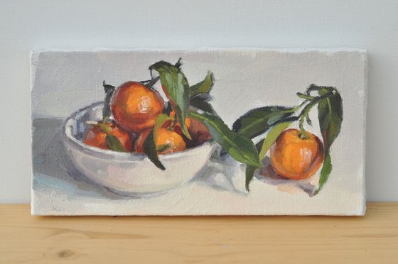 Clementines in a white bowl