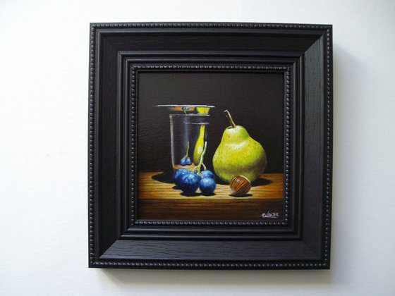 Pear and grape in silver goblet
