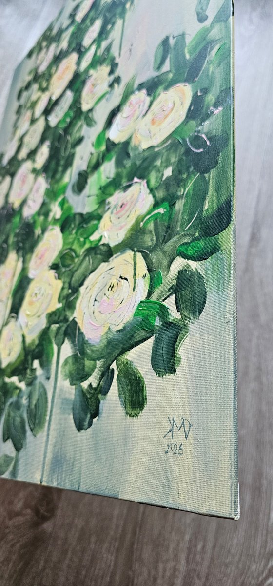 Blooming abstract rose garden in pale yellow