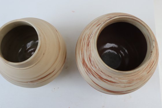 Two mixed clay moon jars