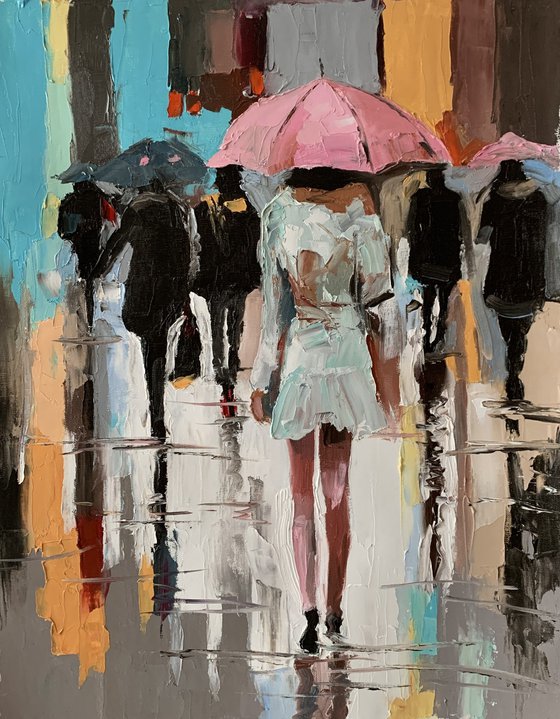 Woman with umbrella in a rainy city.