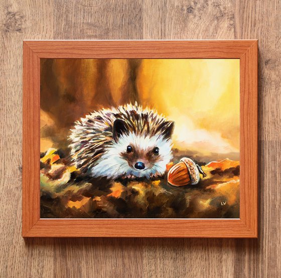 Hedgehog with acorn in fall