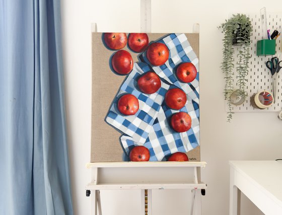 Red apples on a kitchen towel