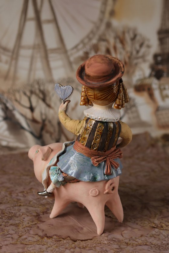 Vintage dressed girl riding the pig. From "Le Carousel, Hommage à l'Innocence" project by Elya Yalonetski