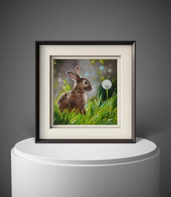 Rabbit with Dandelion in Spring Grass