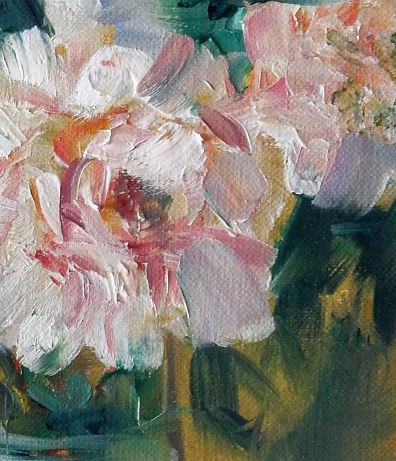 Peonies in a vase. Bouquet of the flowers.