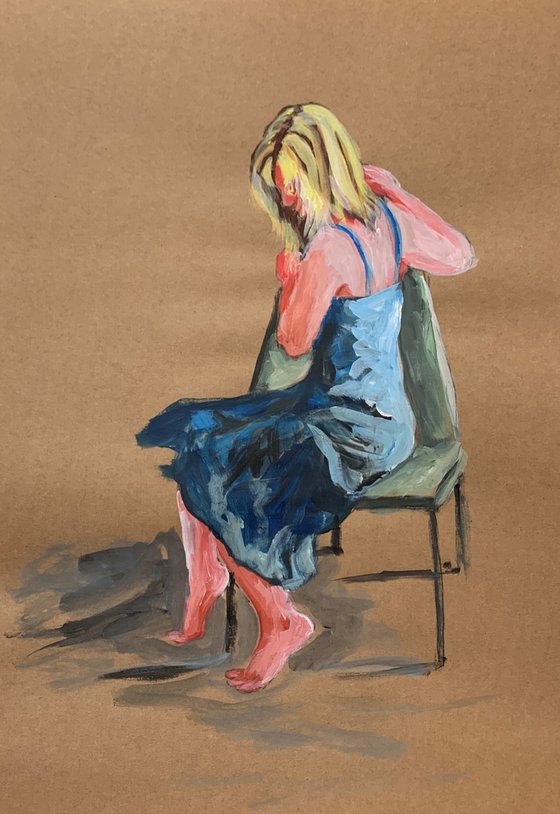 Woman sitting on a chair.