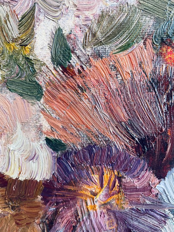 A lush bouquet in a pink vase